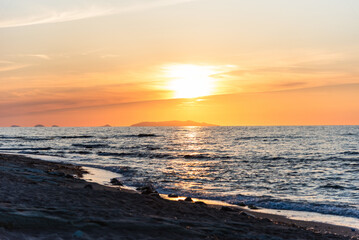 Fototapeta premium Beautiful scenic sunset over mediterranean sea, seen from the Valledoria beach, Sardinia, Italy. 