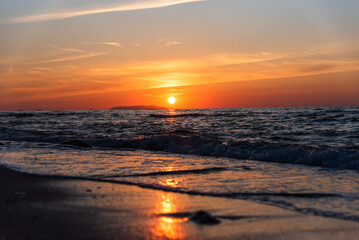 Obraz premium Beautiful scenic sunset over mediterranean sea, seen from the Valledoria beach, Sardinia, Italy. 
