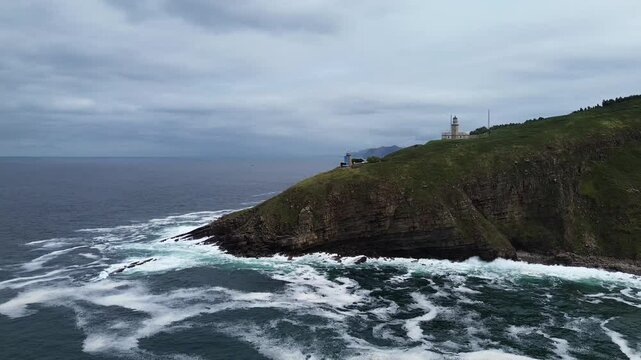 Overcast sky and ocean with waves, drone shooting. 