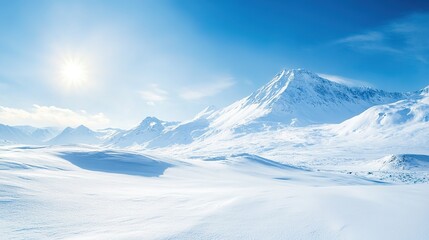 Fototapeta premium Mountain range covered in snow with a clear blue sky on a sunny winter day