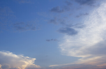 It is a sunset sky with feathery clouds.