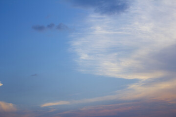 It is a sunset sky with feathery clouds.