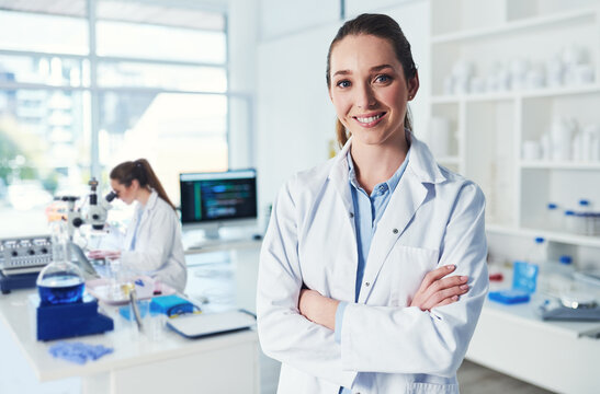 Portrait, scientist and confidence in science laboratory for medical research, biology and pharmaceuticals. Female person, arms crossed and technician in pathology, test or investigation for vaccine