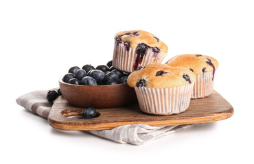 Napkin and wooden tray with tasty blueberry muffins on white background, closeup