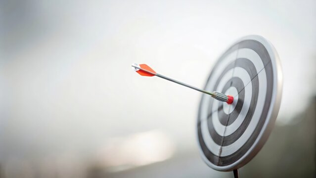 "Focus on Target Background" - A clear, sharp image of a bullseye with an arrow hitting the center, representing focus and precision.
