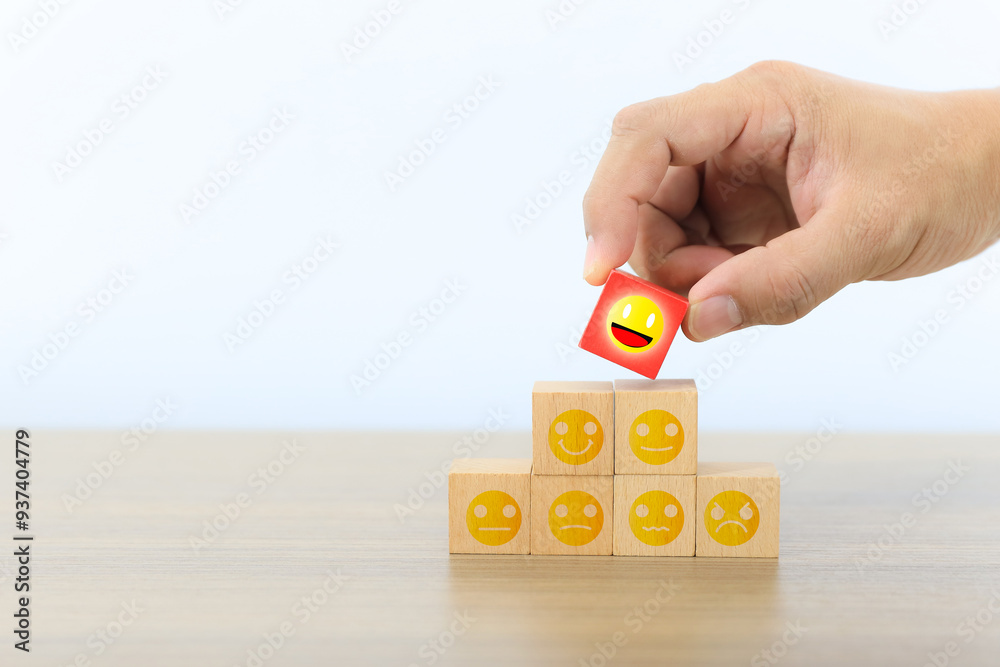 Aufkleber hand choose wooden block with customer service smile face icon for best excellent satisfaction surve