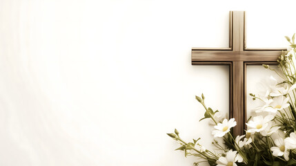 Composition with a Christian wooden cross and flowers against muted white background with copy space for text. Funeral template