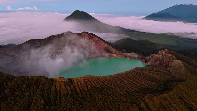 Aerial hyperlapse, Ijen volcano, black mountain turquoise boiler water landscape revealing drone at East Java, Indonesia