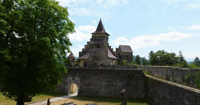 Ostrozac Castle With A Man Standing Over The Walls In Bosnia and Herzegovina. Aerial Pullback Shot