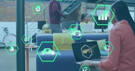 NFT IT text animation over diverse business people working in modern office - Powered by Adobe