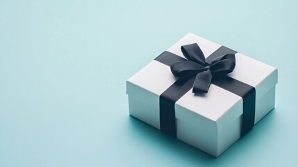 Obraz premium A sleek, modern gift box with a minimalist design, isolated on a bright, clean background with sharp contrasts