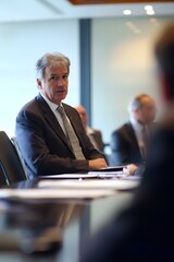 Fototapeta premium Businessman in a Meeting with Other Business Professionals