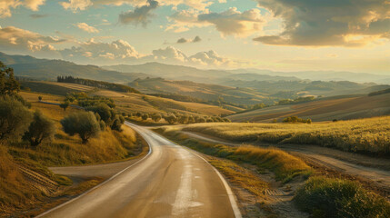 a long a and winding road that disappears off into the distance of a beautiful vista