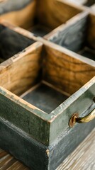 Obraz premium Green Wooden Box with a Metal Handle