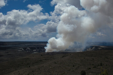 Beautiful nature landscape scenery with cliffs, mountains, volcanos lava fields with lush tropical island vegetation and flowers in Hawaii paradise isle