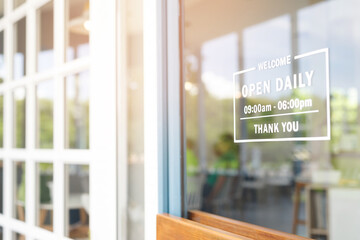 Welcome open sign on shop door. Text on cafe front or restaurant hang on door at entrance. vintage...