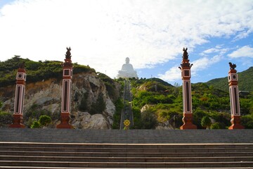 Obraz premium Enormous Buddha Sculpture from the bottom of the stairs in Ong Nui Temple in Quy Nhon