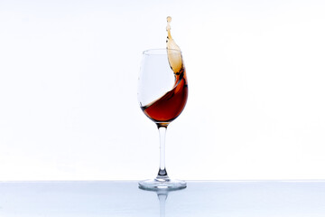 red wine in a glass goblet on a white background
