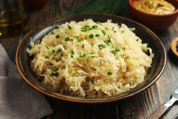 A bowl with traditional German Sauerkraut served in rustic style	