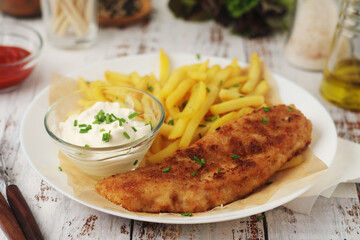 Fish and chips served on the plate, traditional dish of Great Britain