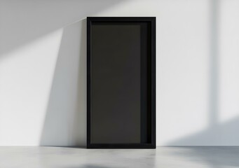Black Frame Mockup Against White Wall