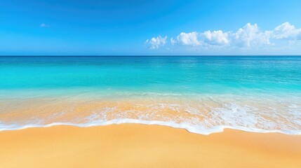 Fototapeta premium Golden sandy beach with turquoise water and clear blue skies