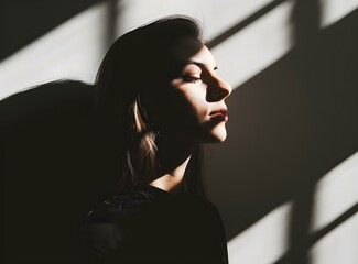 Naklejka premium Woman with Long Hair and Shadows on a Wall