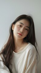 Fototapeta premium Portrait of Asian Woman with Long Hair and White T Shirt