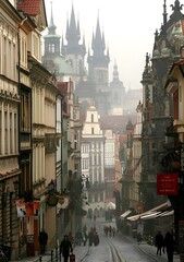 Fototapeta premium Cobblestone Street in Prague with Foggy Cityscape