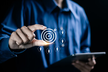 Customer relationship management concept. Target audience, marketing plan and strategies. Businessman holding target icon linked with human icons for customer focus group.