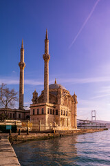 Sunset view of historical Buyuk Mecidiye Cami in, Ortakoy Istanbul, with the calm waters of the Bosphorus. Ramadan