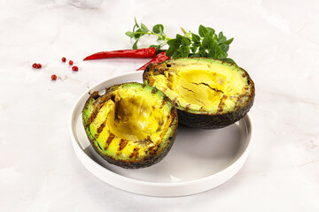 Sliced fresh avocado on the grill