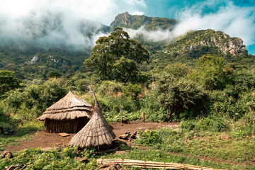 Scenic view of So Tepeth tribal village against the background of Mount Napak in Karamoja, Uganda
