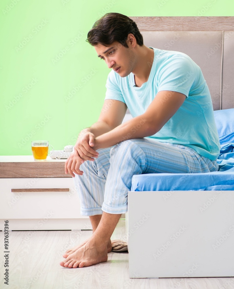 Wall mural man suffering from sleeping disorder and insomnia