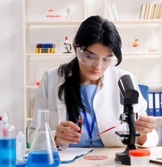 Female chemist working at the lab