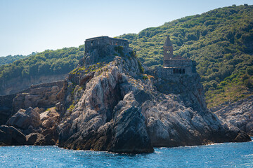 Fototapeta premium Fortified church of St. Peter (Chiesa di San Pietro) on a small rocky peninsula in Porto Venere, Italy