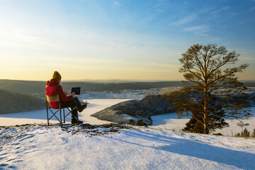Man Using Laptop On Camping In Nature. Remote Work.