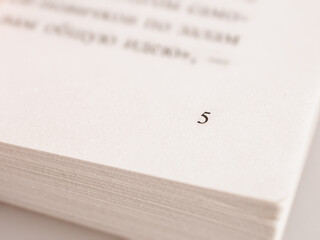 Close-up of a book page capturing text. Ideal image for literature, reading and education themes