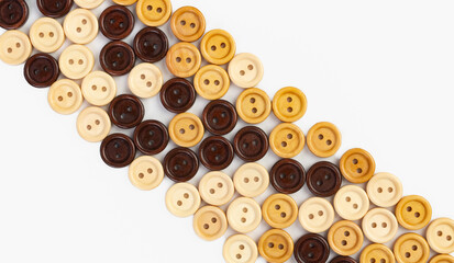 Wooden multicolored buttons on a white background