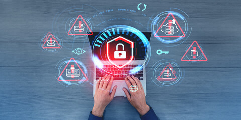 Man hands typing on laptop, lock icon with system alert and warning
