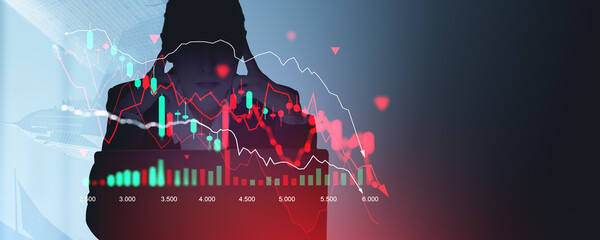 Silhouette of person with financial chart and falling graph on d