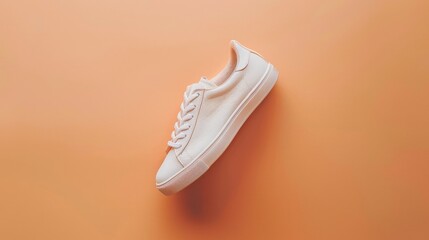White Sneaker on an Orange Background.