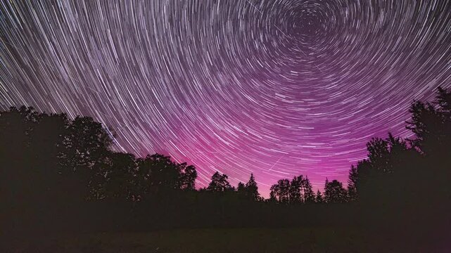 Night star-trail time lapse with northern lights. 