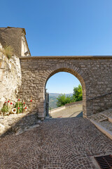 A street between old houses in Pietrabbondante, a village in Molise in Italy.