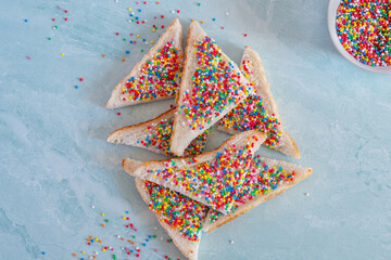 Slices of fairy bread on a plate. Fairy bread is a traditional Australian party food