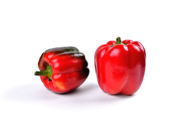 Red bell pepper natural on white background, close-up selective focus