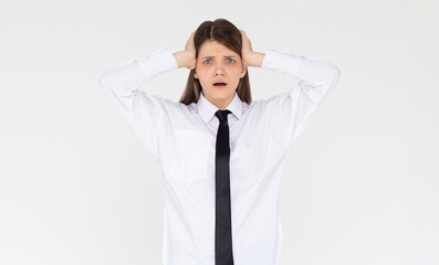 Photo of shocked afraid cute girl open mouth hands head wear white shirt isolated white background