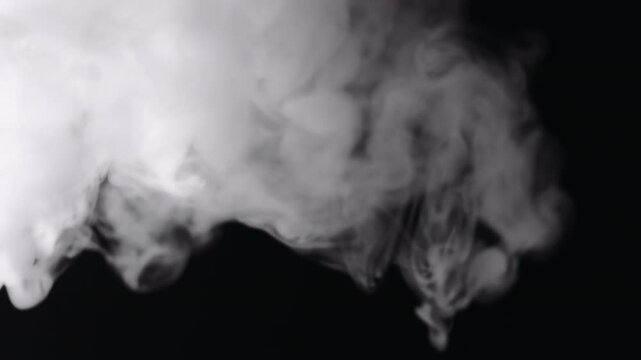 Slow motion closeup vapor stream from right on black background