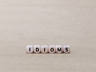 wooden cube with Idioms word