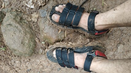 Muddy Sandals on Dirt Path